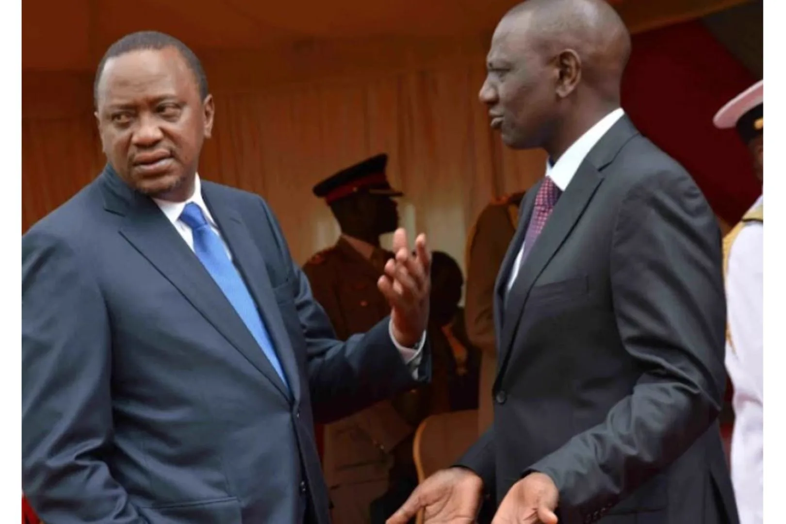 President William Ruto speaking with former President Uhuru Kenyatta at a past state function